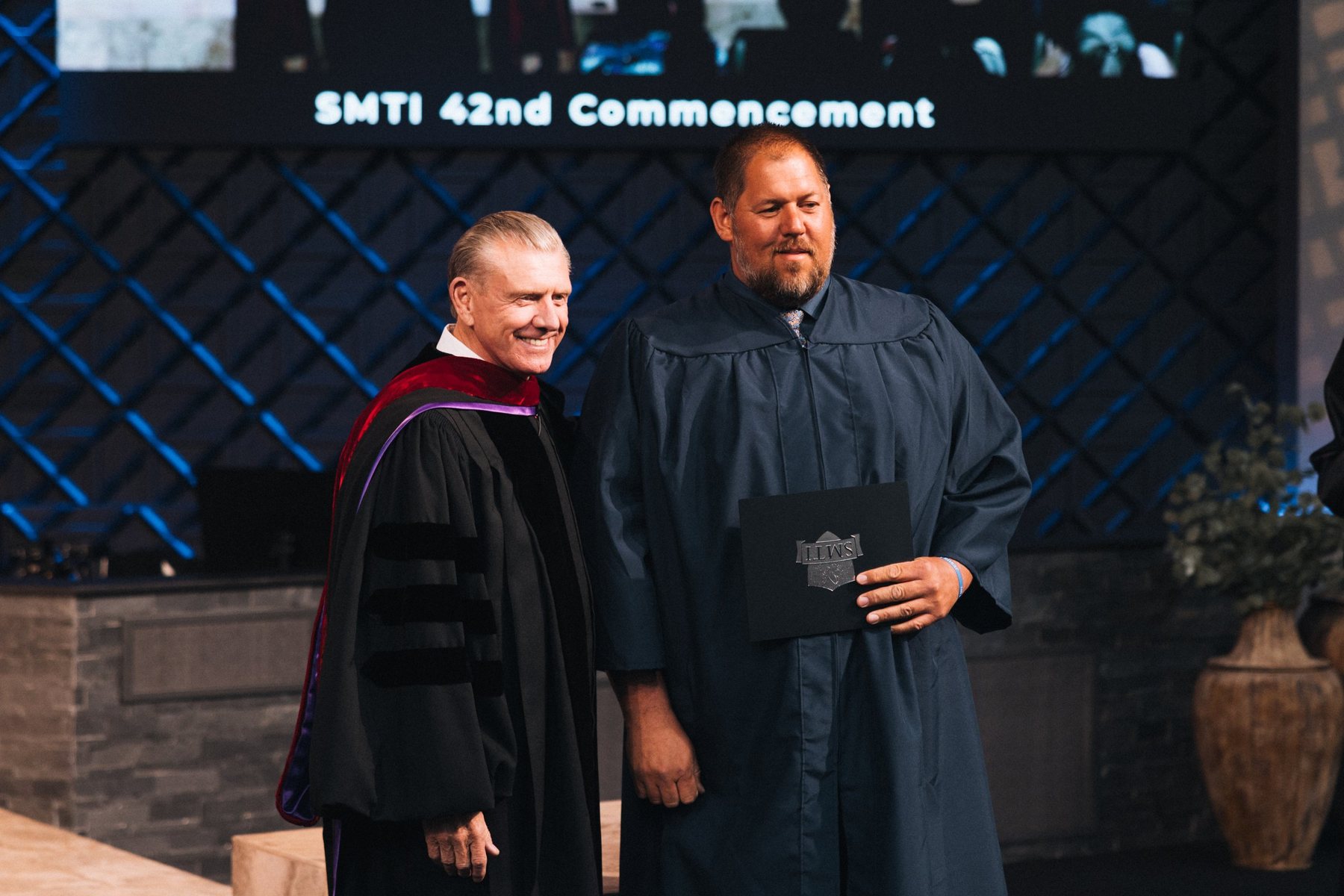 Dr. Mark T. Barclay with a graduate