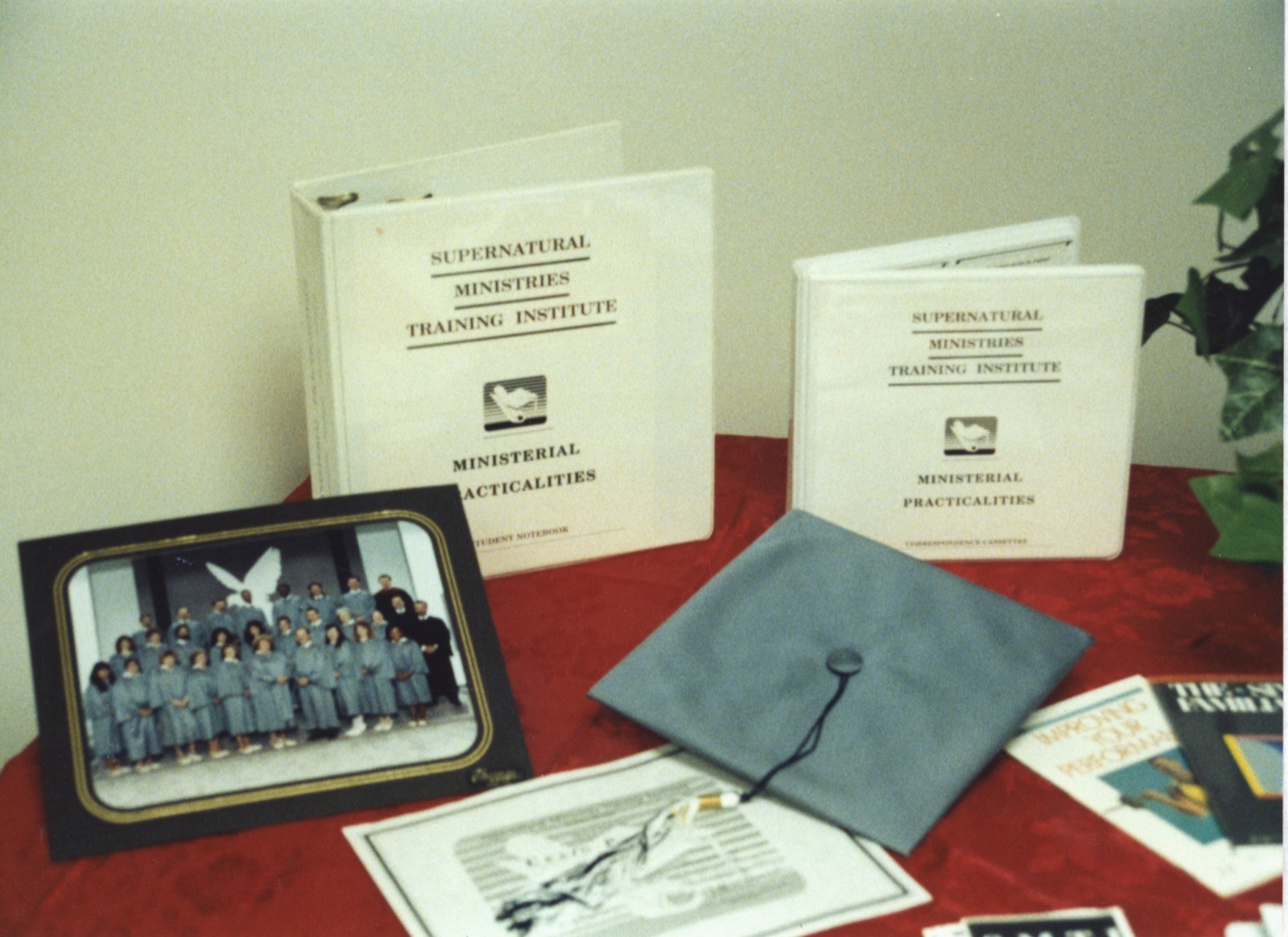 SMTI notebooks and a graduation cap